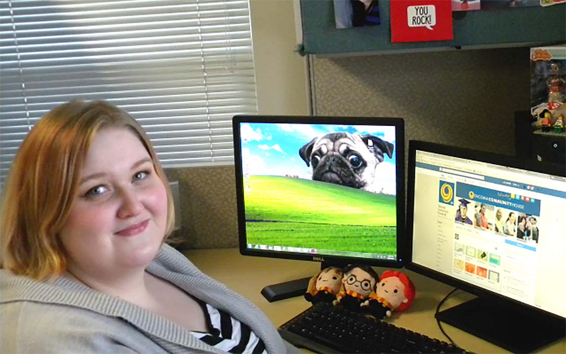 Danielle Burch in front of computer monitors