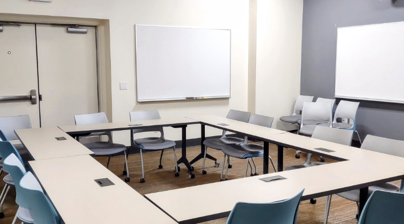 room with tables and whiteboard