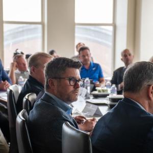 Jim Milgard sits at the board table at the MEC meeting