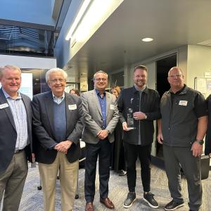 Group photo of Don Clark Jr., Larry Kopp, Tom Falskow, Michael Hiller, MBA, Erin Galeno, and Milgard School Dean Altaf Merchant at the Globe Awards 2023 