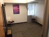 Photo of reflection room showing chairs, prayer mats and waterfall feature