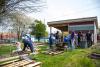 Picture of students working on the giving garden. leads to the student involvement section